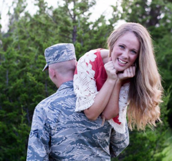 Photo of Kami Gilstrap swung on the shoulders of her husband, Black Gilstrap.