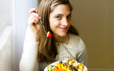 Kathy eating a salad