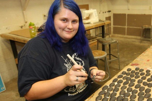 Kelcie with her artwork