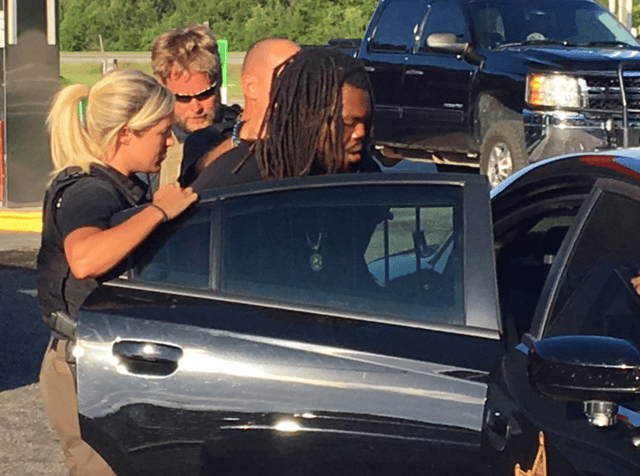 Photo of Kenneth the moment they arrested him for the murder of the Miller family.