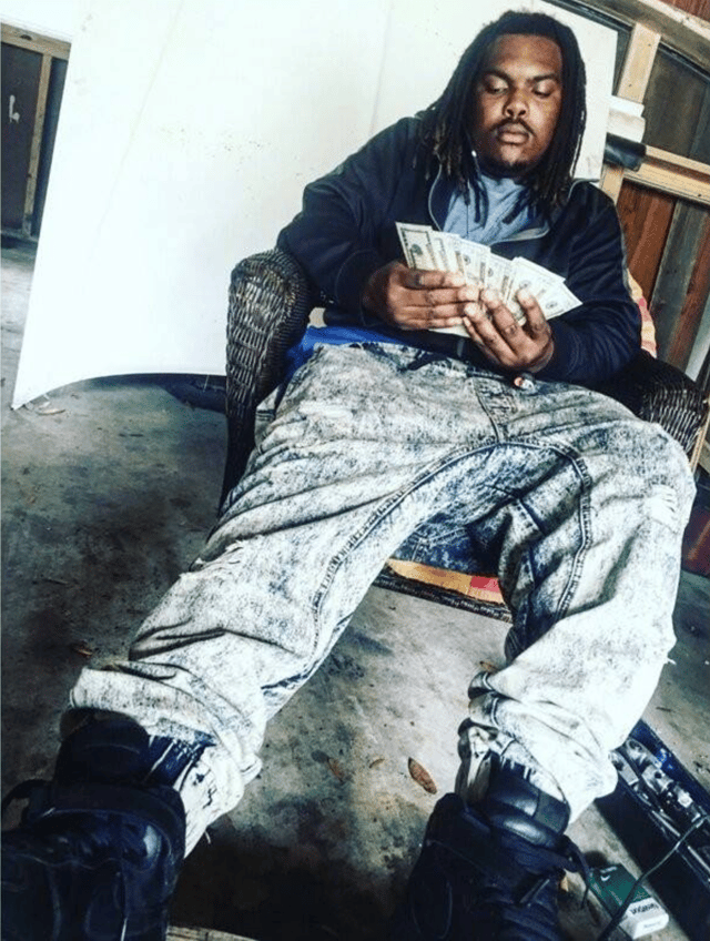 Photo of Kenneth with money.