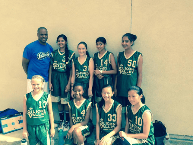 Photo of Kim with her teammates posing for a picture.
