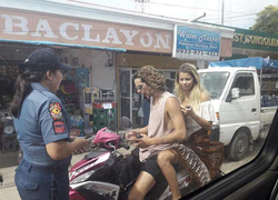 Photo that has since gone viral of Kinsey Golden and Trav Springer, her boyfriend being pulled over in Philippines.