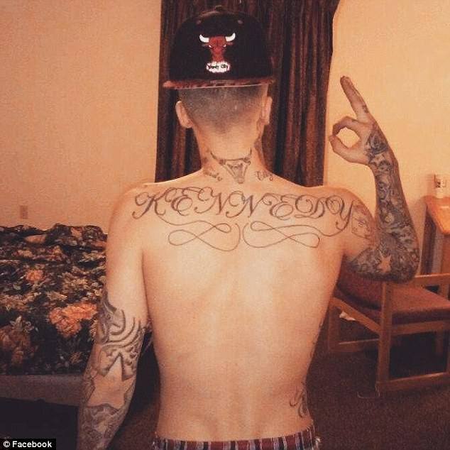Showing off his tattoos