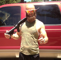 Photo of Lee Goggin with a beard.