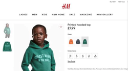 Photo of Liam Mango wearing the green sweater that says, "Coolest Monkey in the Jungle" as part of the H&M campaign.