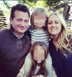 Photo of Lukasz Niec with his wife and family.