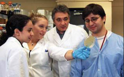 Young Michael Chikindas at a lab with his fellow colleagues.