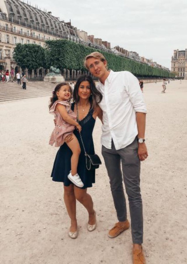 Mimi Ikonn
with her husband and their child