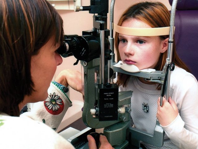 Doctors checking her eye condition