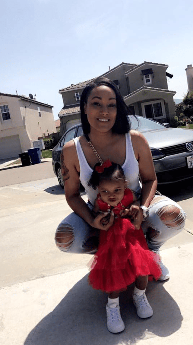 Photo of Monique with her child.