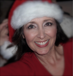 Photo of Monique Marie Long wearing a Santa hat.