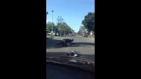 The officer is seen punching Nandi