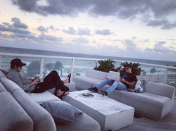 Working on a rooftop alongside Sean Kelly