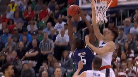 Northwestern's Dererk Pardon gets blocked by Zach Collins hand coming from inside the cylinder; the referees didn't call it.