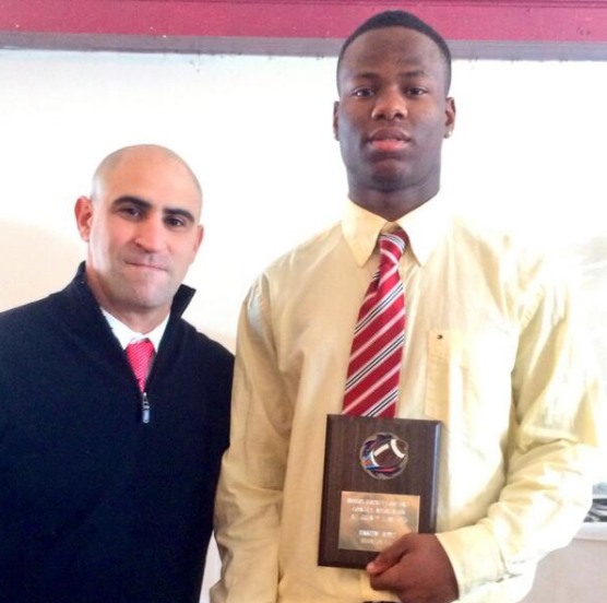 Hakeem alongside Bryan Gallagher with his All-County Linebacker Award