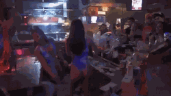 A bottle girl recorded swiping a stripper's money off the stage