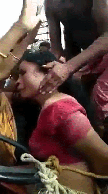 The crowd gathers for her beating