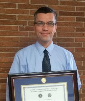 Lt. Patrick Weatherford at his graduation from the FBI National Academy