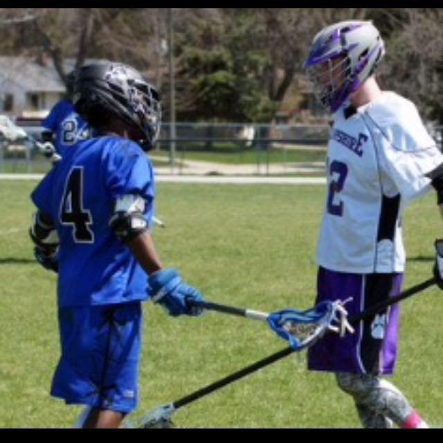 Patryck starring down his opponent on the Lacrosse field