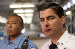 Lt. Paul Bauer, right and officer Jason Ayala discuss the sudden death of horse Mikey C., partner of mounted officer Paul Casasanto, at the Chicago Police Mounted Patrol Stable on 71st & South Shore Drive, Tuesday, August 30, 2011.