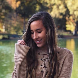 Polly Rogers by a lake.