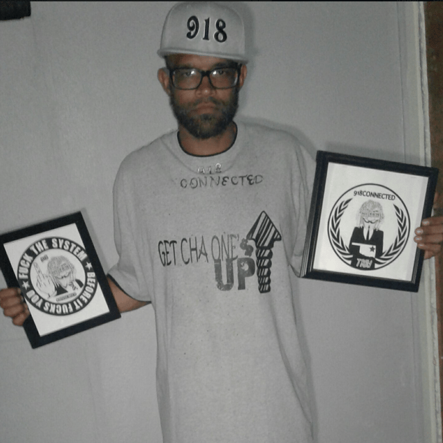 Ralph holds some frames.
