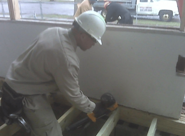 Photo of Ramon working at a construction site.