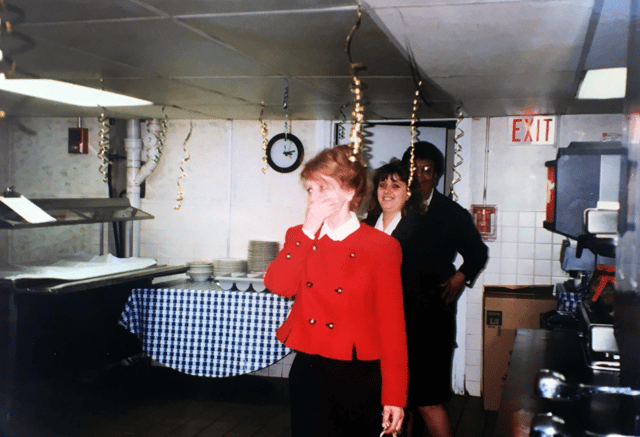 Photo of Rebecca celebrating with her staff at the Colonnade Hotel Boston in 1997.