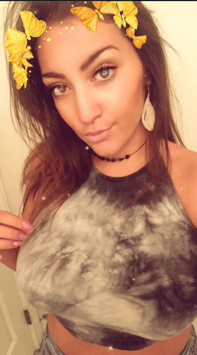 Selfie of Sarah using a Snapchat filter.