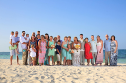 Wedding photo of Sonny and Heather Melton on the beach with family