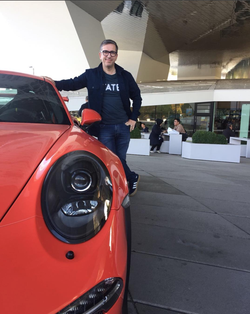 The photo of Spiros Margaris with a sports car.