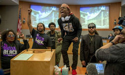 Stevante Clark rallying up protestors at the City Council hearing regarding the death of his brother, Stephon Clark.