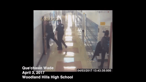 Moments when Steve and another officer grab a student into the principal's office.