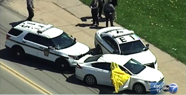 Steve Stevens' white Ford Fusion and two police cars