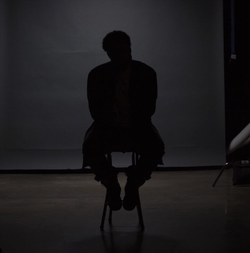 Photo of Steven Caple Jr. in the dark.
