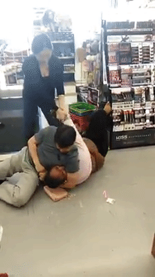 Lim begins to aggressively headlock her.