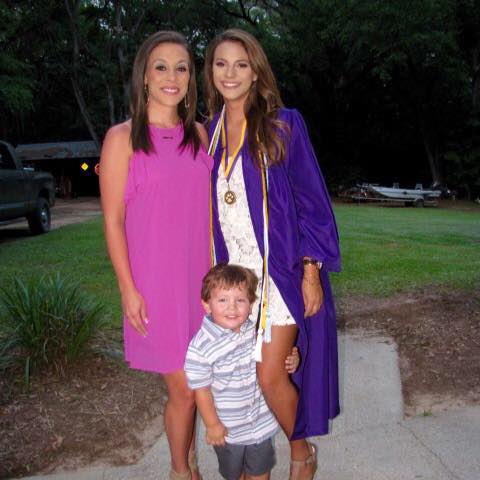 Photo of Sydney at her graduation with family