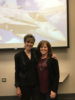 Tammie Jo Shults with a woman at an event honoring her work.