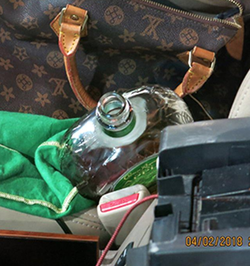 Photo of the bottle of Crown Royal that was seen inside of her vehicle at the time of her DUI arrest.