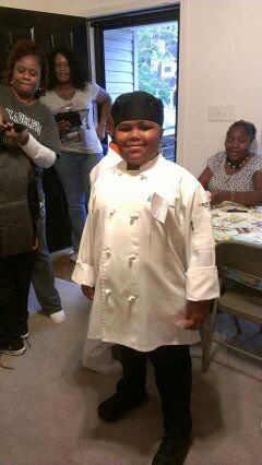 Tedra dressing up as a chef