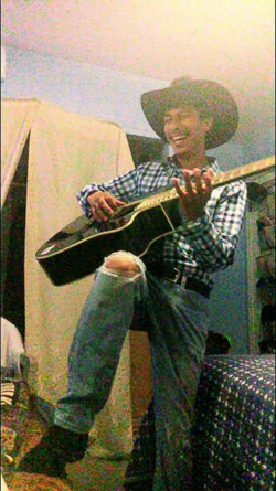 Victor Mozqueda playing his guitar