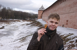 Photo of Vitaly Bespalov standing outside of a building.