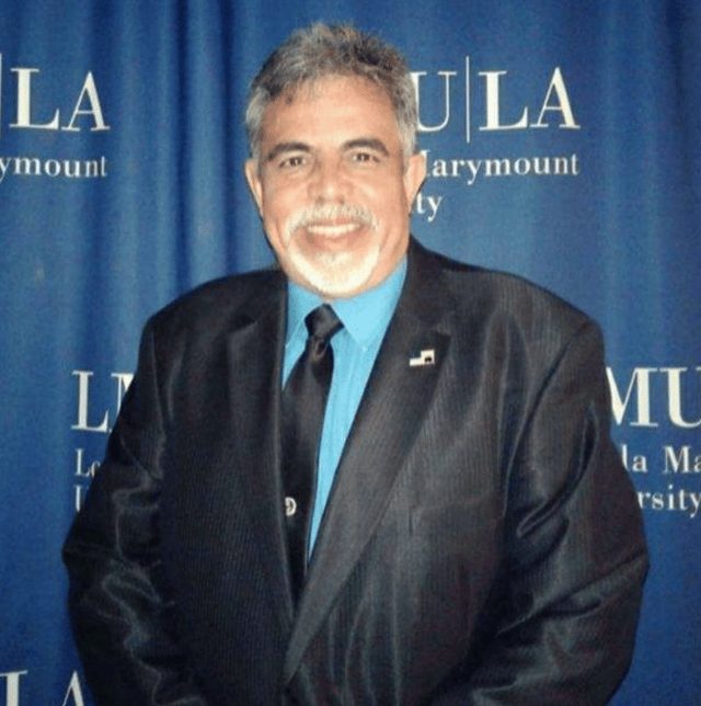 Photo of Will at college event.